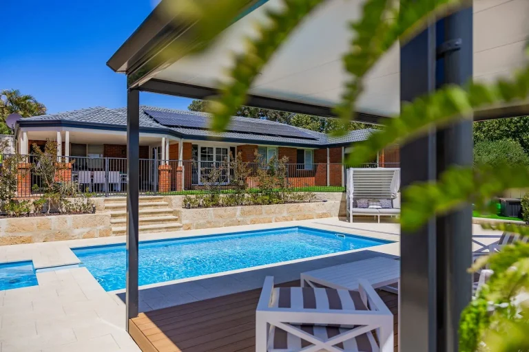 Pool with paving and a pergola deck in Baldivis