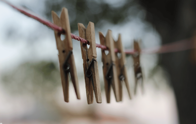 Wooden pegs on a clothesline