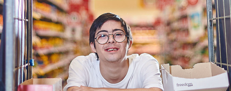 Smiling young man in a Good Sammy store