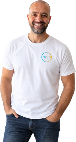 James Alviani, founder of Halo Digital, smiling in a Halo Digital t-shirt with his hands in his pockets