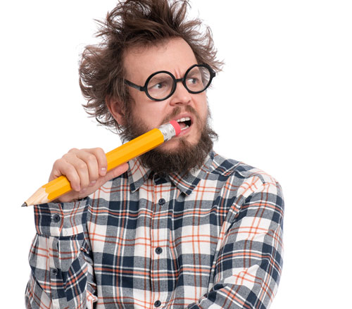 Confused man in glasses holding a pencil